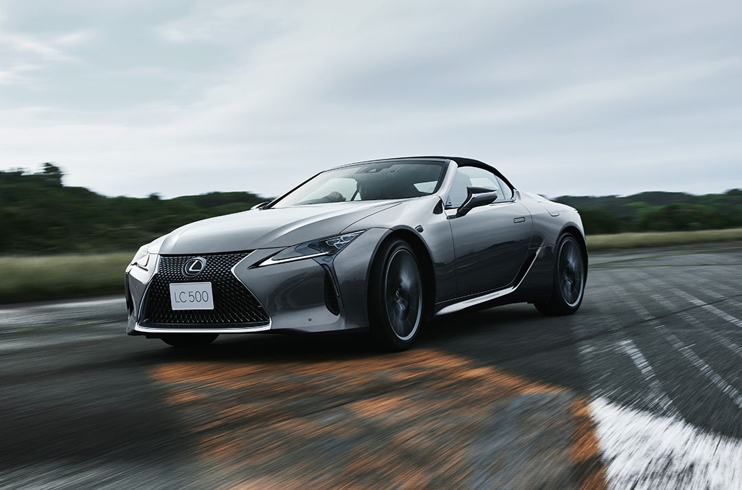 Lexus LC Convertible driving against an overcast background