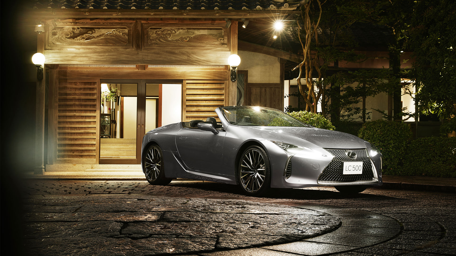 Lexus LC Convertible parked in a driveway at night