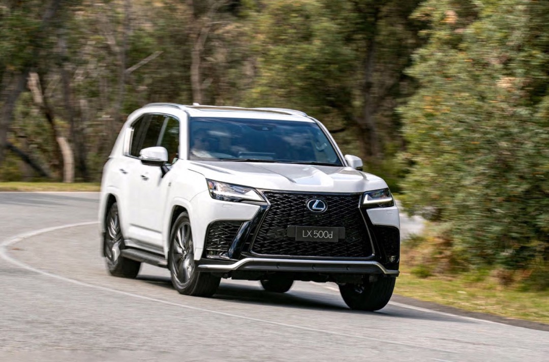 White Lexus LX F Sport turning a corner
