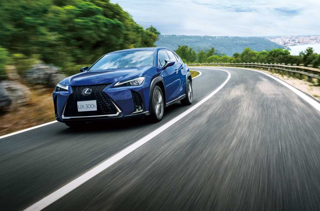 Blue car speeding on the road.