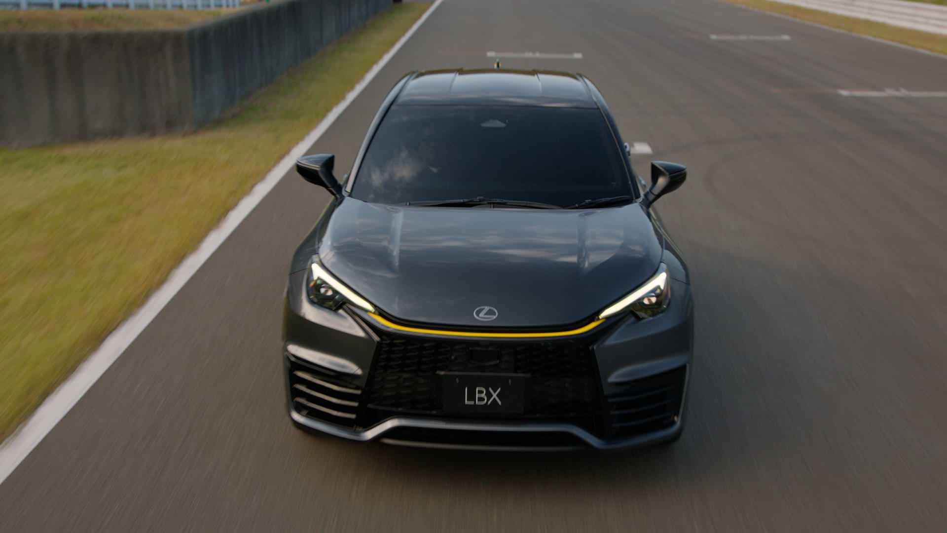 Front view of a moving car on a track.