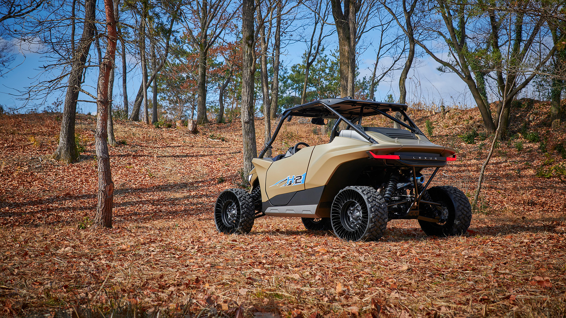 A Lexus ROV Concept 2 Buggy is shown parked in a leafty autumn fortest scene.