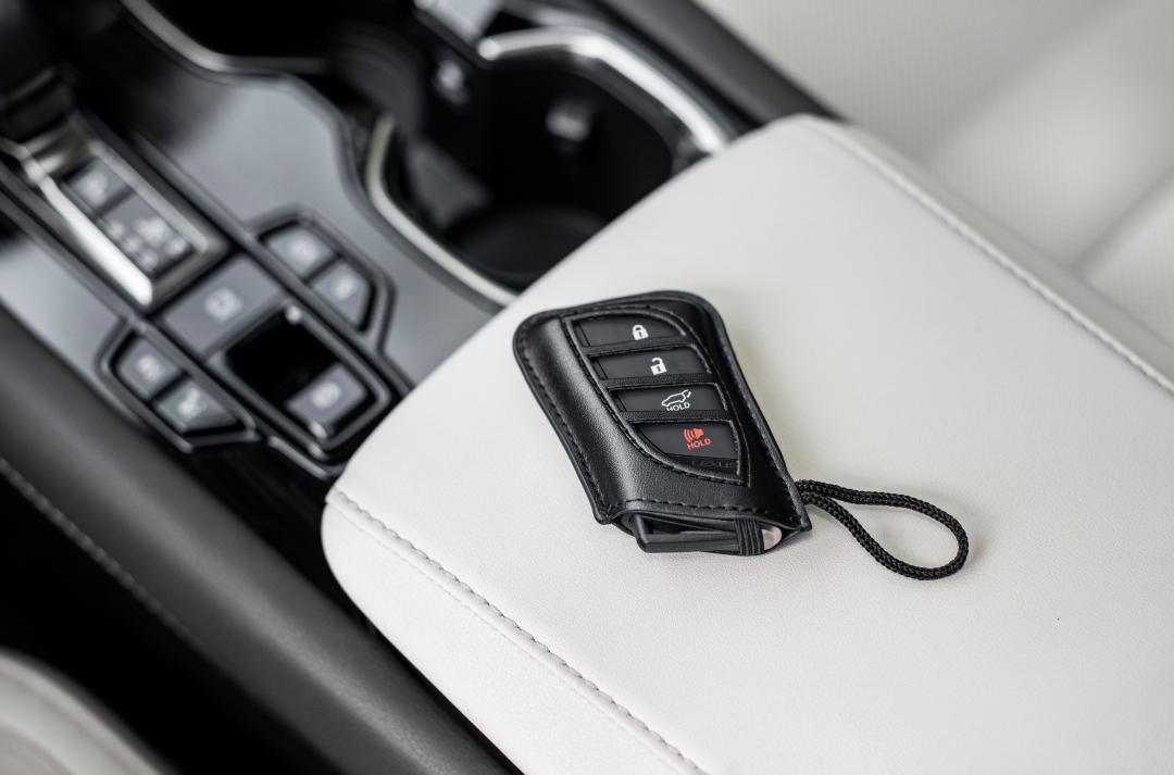 Lexus keys sit on the console of a Lexus RX.